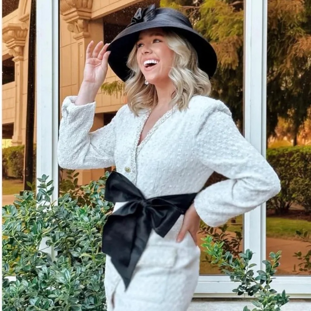 Elegant White Textured Coat with Black Bow